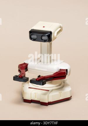 Milan, Lombardy, Italy - November 23, 2024: R.O.B. Robotic Operating Buddy, a vintage Nintendo Family Computer accessory from 1985. Shown at Ctrl+Alt Stock Photo