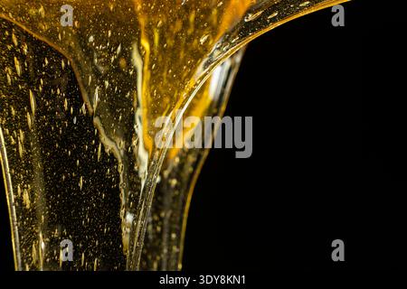 Flowing golden honey with air bubbles texture Stock Photo