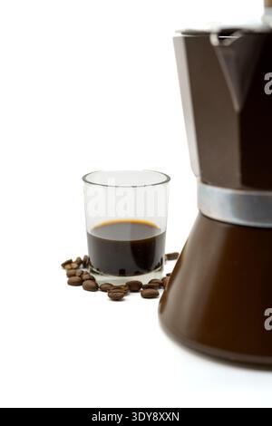 Close-up of moka pot and espresso glass with coffee beans on white background, minimal composition Stock Photo