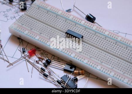 Electronic project start. Electronic circuit basics. Integrated circuit on the breadboard. Stock Photo