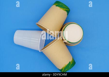 Ecological disposable and biodegradable cups versus a single-use plastic cup. The use of single-use plastic cups is prohibited. Copy space. top view Stock Photo