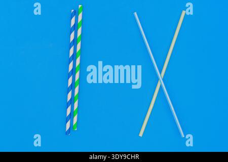 Plastic straw. Plastic pollution is harmful to marine life. Environmental concept. Ban single-use plastic campaign. Use of recyclable cardboard straw. Stock Photo