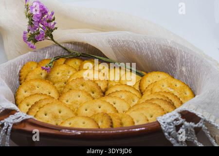 Bowl with crackers for appetizer, isolated on white background. Stock Photo