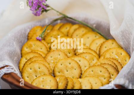 Bowl with crackers for appetizer, isolated on white background. Stock Photo