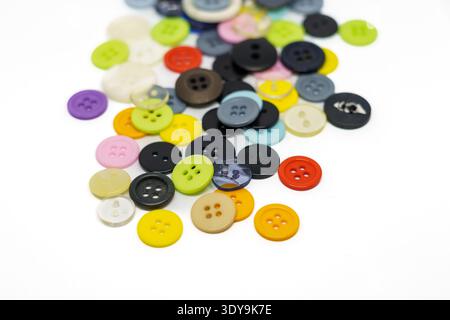Set of different colored buttons on white background. Top of view Stock Photo