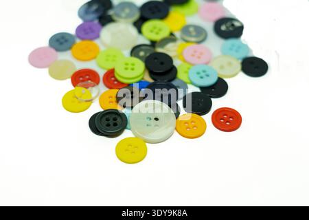Set of different colored buttons on white background. Top of view Stock Photo