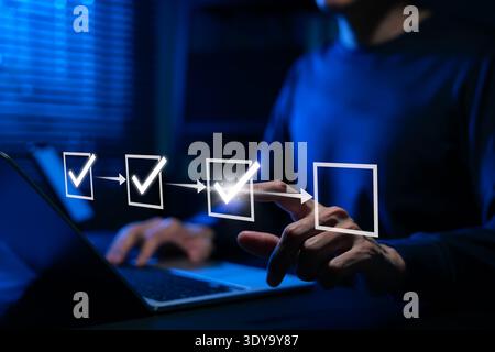 Business workflow checklist and task management automation concept. Professional selecting digital checklist step with check marks represent project Stock Photo
