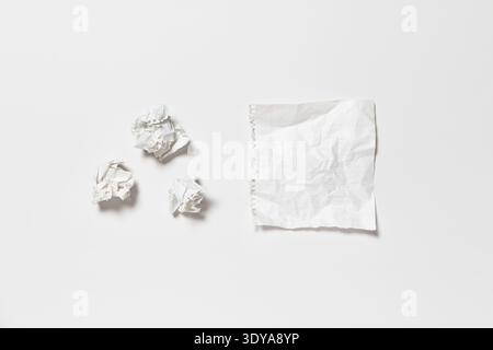 Ripped crumpled blank page of a spiral notepad on a white background. Stock Photo