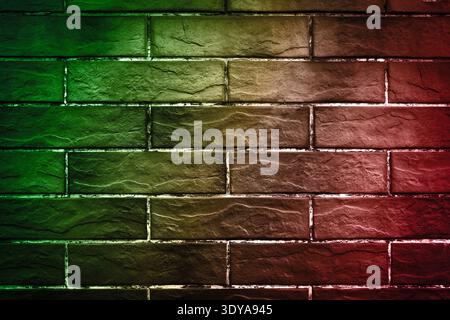 Neon lights on brick wall. Color gradient from red to green Stock Photo