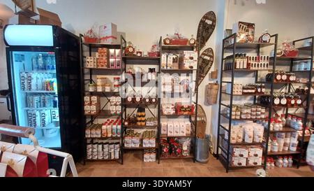 Toronto, ON, Canada - September 9, 2025: Shelves are full of maple syrup products in a store; it presents a sweet Canadian treat. Stock Photo