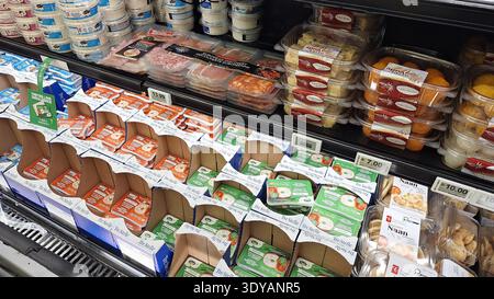 Toronto, ON, Canada - March 5, 2026: The supermarket shelf presents a variety of food products, from cheeses to meats. Stock Photo