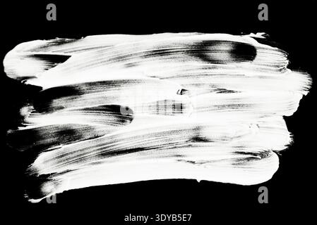 A dense and messy white chalk scribble or hatch texture hand drawn on a black background for backgrounds or masking. Stock Photo