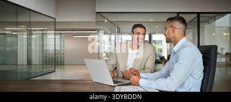 Happy professional business team people of two executive men working in office. Stock Photo