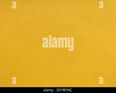 Bright yellow matte detail paper texture. Blank page pattern. Stock Photo