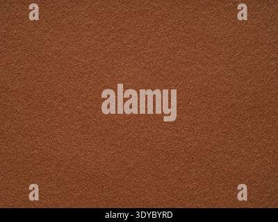 Brown felt fabric material texture. Full frame large matt backdrop wallpaper. Matt retro velvet pattern or vintage background in high resolution Stock Photo