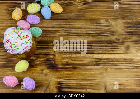 Easter cake and easter eggs on a wooden table. Top view, copy space Stock Photo