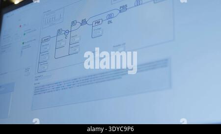 Quantum computing cryptography displaying binary code and optical diagram on screen Stock Photo