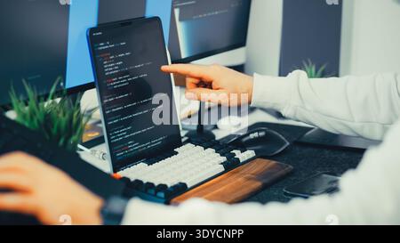 Software developer programming laptop screen code workspace. Technology workstation modern desk environment. Programming interface digital development Stock Photo