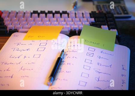To do list notebook checklist task progress planning. Handwritten task list productivity workflow organization sticky notes planning routine efficienc Stock Photo