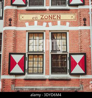 Colorful Window on a brick wall in Amsterdam. Stock Photo
