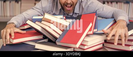 teacher get knowledge from books. man teacher at bookstore. college tutor reading books. back to school. school teacher in library. book lover man Stock Photo