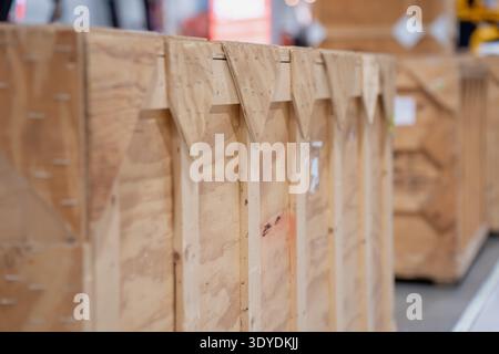 Timber cargo crate in storage area with blurred background boxes, secure shipping container for international freight, logistics operations and handli Stock Photo