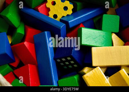 High angle view of colorful wooden toy blocks in a messy pile, Stock Photo