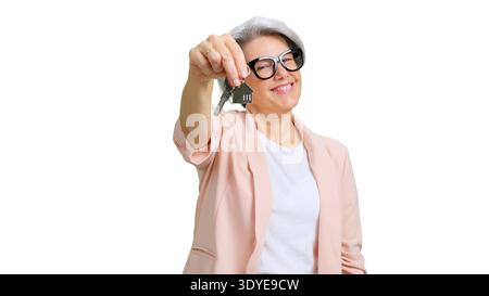 Realtor woman holding house keys for new home Stock Photo