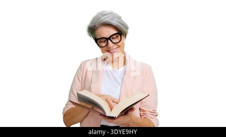 Senior woman smiling enjoying reading book on white background Stock Photo