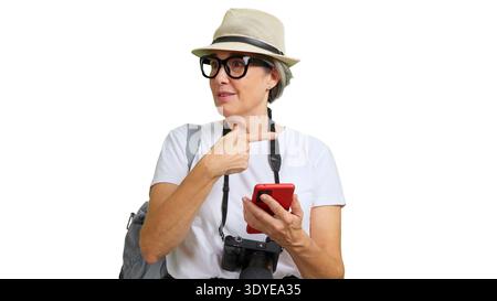 Senior woman tourist holding smartphone asking direction Stock Photo