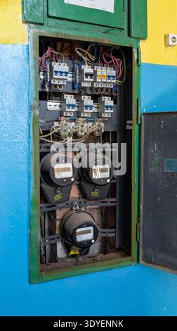 Electrical meter with distribution fuse board in old industry building. Electrical background. Electric distribution board consumer unit with fuse box Stock Photo
