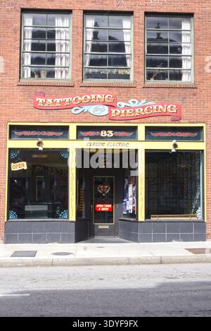 Entrance of a tattoo and piercing shop Stock Photo