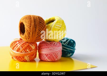 Many different spools of thread on light grey background, closeup Stock Photo