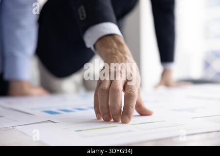 Cropped close up businessman hand showing detail on paper project Stock Photo