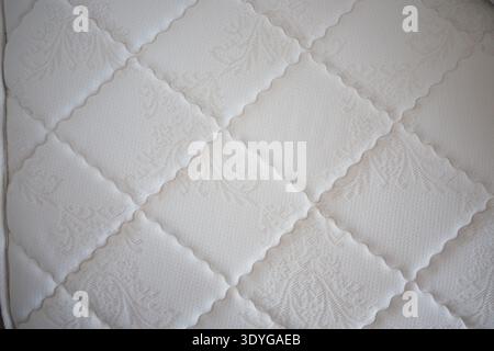 Quilted mattress surface in good condition Stock Photo