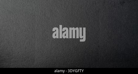 Black matte paper surface plain material with gradient light close up  macro view Stock Photo