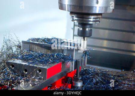 Metal processing machine. Machining center. CNC vertical machining center. Computer control. Metal milling equipment. Metal shavings. Machines production tools Industrial Stock Photo