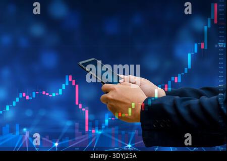 Business man trader investor analyst using mobile phone app analytics for cryptocurrency financial market analysis, trading data index chart graph on Stock Photo