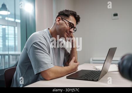 Anxious Caucasian Software Engineer Concentrating Deeply On Fixing Critical Computer Errors Rapidly Stock Photo