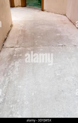 hall with concrete flooring during city apartment renovation Stock Photo