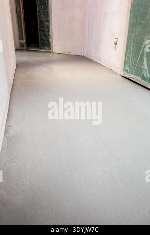view of self-leveling floor in hall during renovation of city apartment Stock Photo