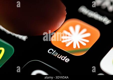 Munich, Germany. 07th Mar, 2026. The logo of the Claude app can be seen on the display of a smartphone in Munich (Bavaria, Germany) on March 7, 2026, while a finger taps on the app's icon. Claude is an AI chatbot and a large language model (LLM, artificial intelligence, chatbot) developed by Anthropic, a company founded by former OpenAI employees. (icon, pointing finger, company, symbol image, symbol photo, illustration, symbolic photo, illustrative photo, theme image, general image, theme photo) Credit: Matthias Balk/dpa/17�Թ����� Live News Stock Photo