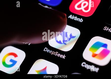07 March 2026, Lower Saxony, Norden: The logo of the DeepSeek app can be seen on the display of a smartphone in Munich (Bavaria, Germany) on March 7, 2026, while a finger taps on the application icon. Hangzhou DeepSeek Artificial Intelligence Basic Technology Research Co, Ltd, usually shortened to DeepSeek, is a startup from China that specializes in the development of language models (artificial intelligence, chatbot, large language model, LLM) based on artificial intelligence. (icon, pointing finger, company, symbol image, symbol photo, illustration, symbolic photo, illustrative photo, theme Stock Photo