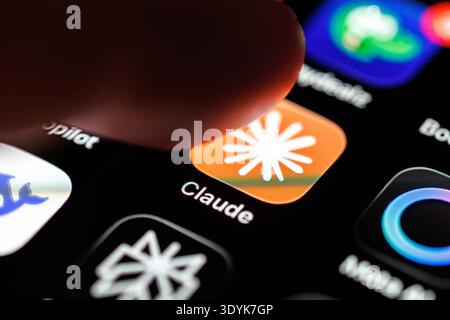 Munich, Germany. 07th Mar, 2026. The logo of the Claude app can be seen on the display of a smartphone in Munich (Bavaria, Germany) on March 7, 2026, while a finger taps on the app's icon. Claude is an AI chatbot and a large language model (LLM, artificial intelligence, chatbot) developed by Anthropic, a company founded by former OpenAI employees. (icon, pointing finger, company, symbol image, symbol photo, illustration, symbolic photo, illustrative photo, theme image, general image, theme photo) Credit: Matthias Balk/dpa/17�Թ����� Live News Stock Photo