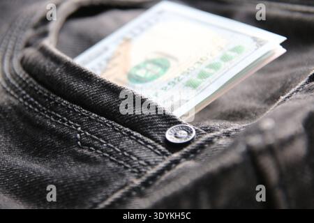 American dollars USD banknotes in jeans pocket. Stock Photo