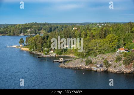 Forested island shoreline in the Stockholm archipelago along Baltic Sea coast, Stockholm County, Sweden Stock Photo