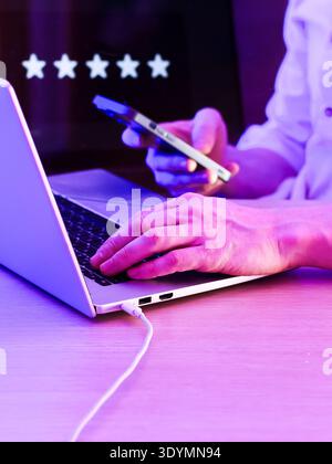 Fingers pressing keys on computer with caution symbol in background, evoking cyber vigilance. Stock Photo