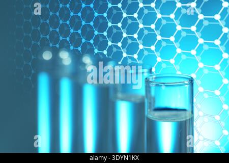 Samples in test tubes and hexagonal lattice of carbon atoms on blue gradient background. Biochemistry researches Stock Photo