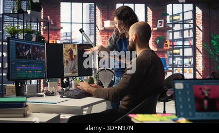 Man and woman collaborate on content creation for the media industry, analyzing data and insights, editing video footage and adjusting branding elements. AI powered. Camera A. Stock Photo