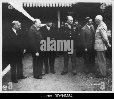 Eisenhower and British Prime Ministers.  Seen at a railroad station in England are, left to right:  Mackenzie King, Prime Minister of Canada; Winston Churchill, Prime Minister of England; Peter Frazer, Prime Minister of New Zealand; General Dwight D. Eisenhower, Supreme Allied Expeditionary Force Commander; Sir Godfrey Huggins, Prime Minister of Rhodesia; and General Jan Smuts, Prime Minister of South Africa.  May 12, 1944. Stock Photo